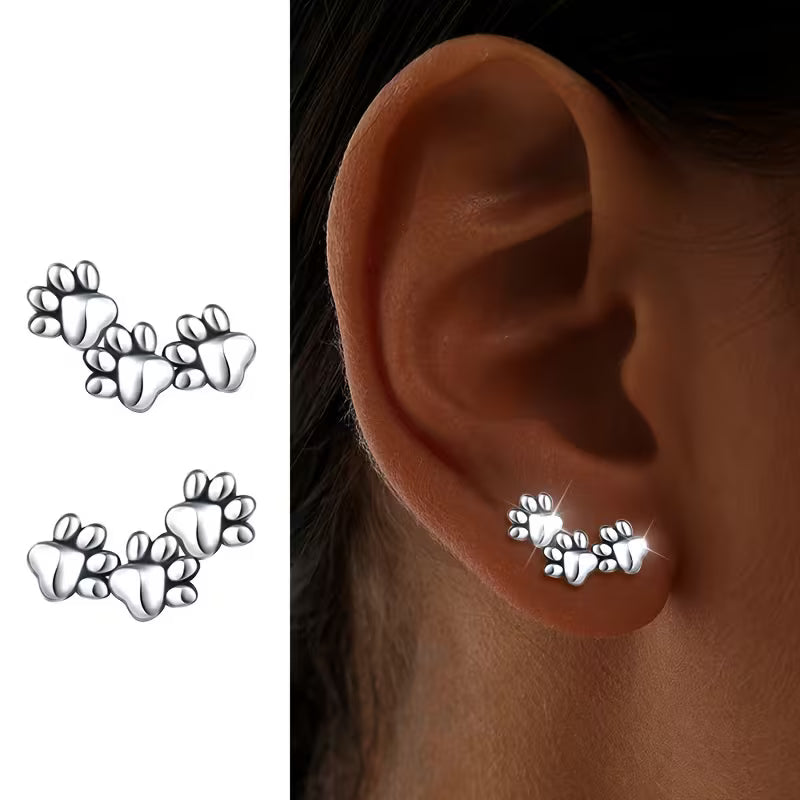 Pendientes de botón de acero inoxidable con huellas de animales