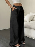 Elegantes pantalones de pierna ancha.