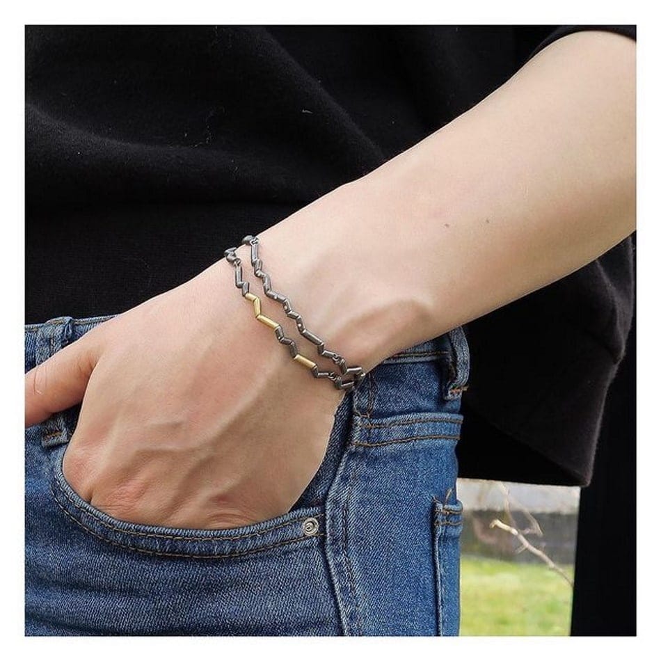 Pulsera Momentum chapada en rodio negro con detalles dorados