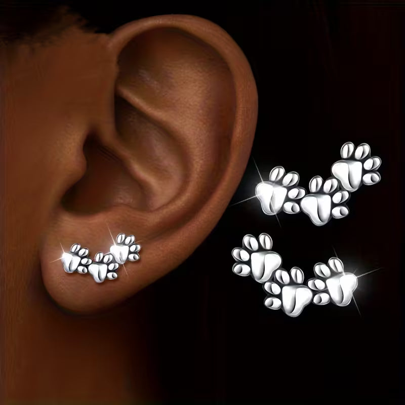 Pendientes de botón de acero inoxidable con huellas de animales