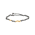 Pulsera Momentum chapada en rodio negro con detalles dorados